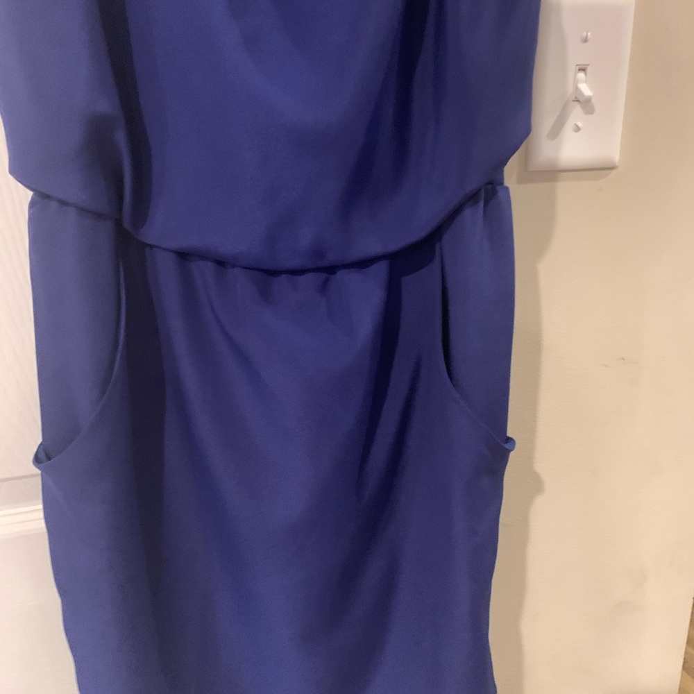 Short cocktail like skirt. Could be dressed up, or dressed down. Has pockets.